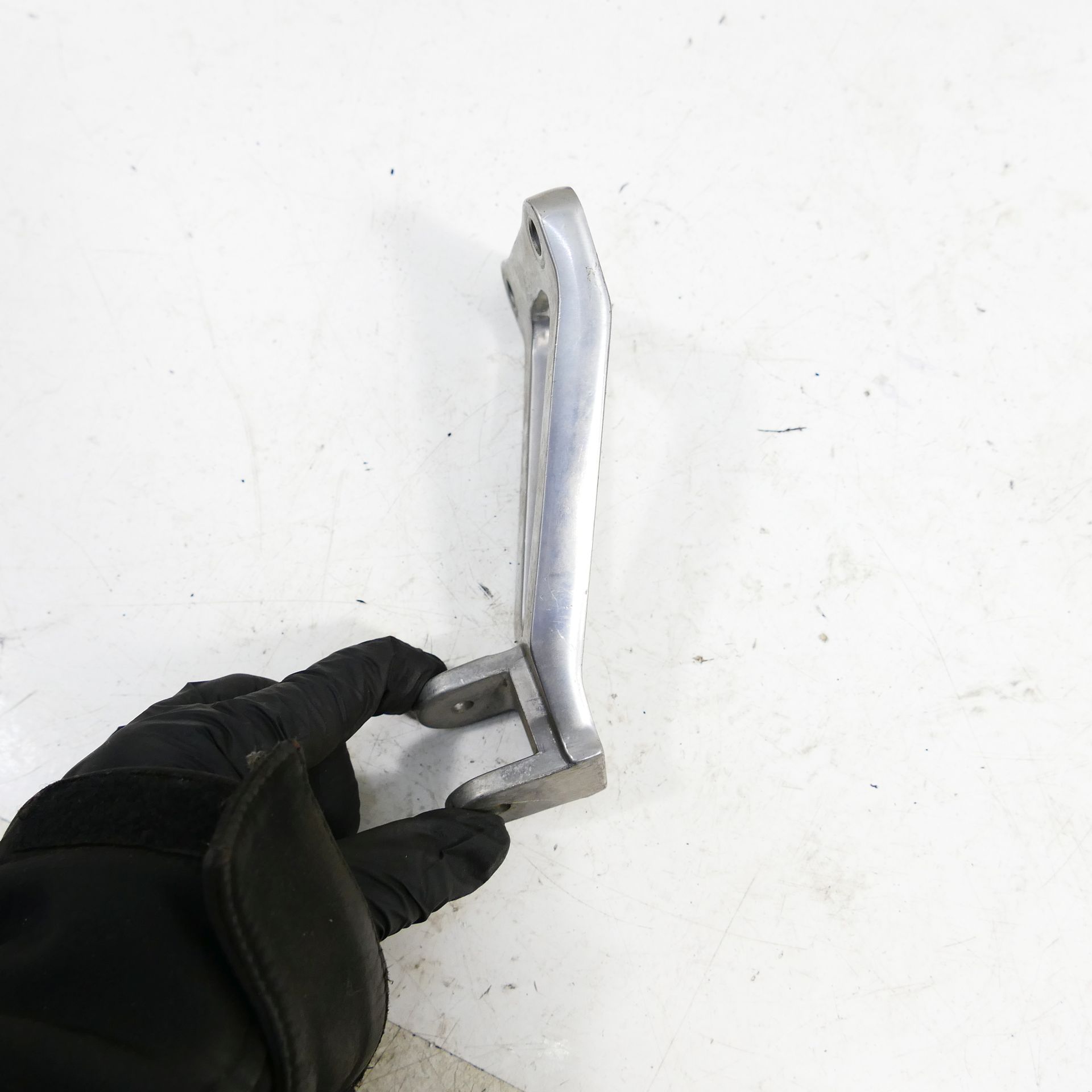 A Kawasaki ZX-R 750 J Rear Left Footrest Holder Footrest Plate 63668